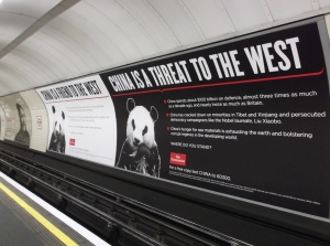 Two Economist Posters Hung Side by Side in a London Tube